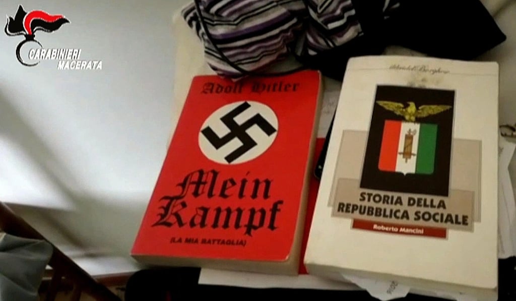 A scene from a handout video made available by the Italian police on Monday shows a copy of Hitler’s book “Mein Kampf” (L) and “Storia della Repubblica Sociale” (History of the Fascist republic) which was found at Luca Traini’s home n Macerata. Photo: EPA A scene from a handout video made available by the Italian police on Monday shows a copy of Hitler’s book “Mein Kampf” (L) and “Storia della Repubblica Sociale” (History of the Fascist republic) which was found at Luca Traini’s home n Macerata. Photo: EPA