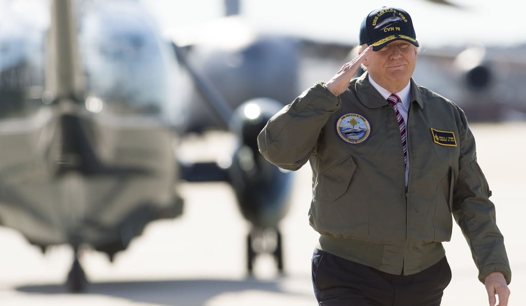 US President Donald Trump salutes as he walks to Air Force One prior to departing from Langley Air Force Base in Virginia on March 2, 2017. Photo: Agence France-Presse