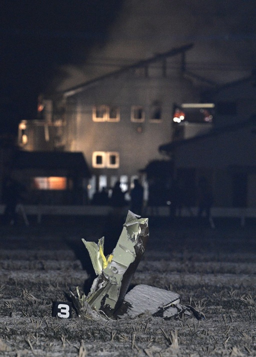 Part of the wreckage of the Self-Defence Force Apache attack helicopter that crashed in a town in Saga prefecture. Photo: Kyodo