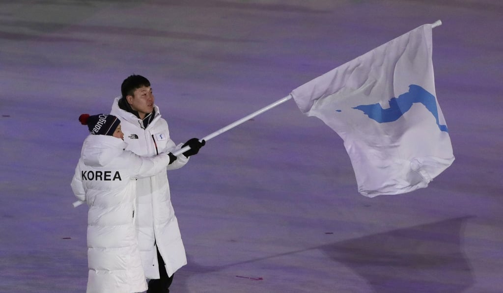 North Korea's Hwang Chung Gum and South Korea's Won Yun-jong walk onto the stage during the opening ceremony of the 2018 Winter Olympics in Pyeongchang. Photo: AP