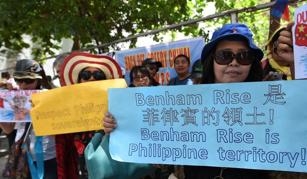 Filipinos outside the Chinese consulate in Manila protesting against China’s alleged incursion of Benham Rise. Photo: AFP