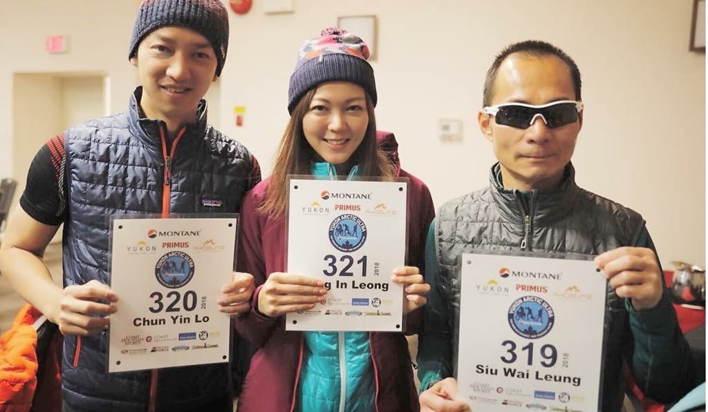Team Leader Steve Lo, Inez Leong and Gary Leung with their race numbers. Photo: Handout
