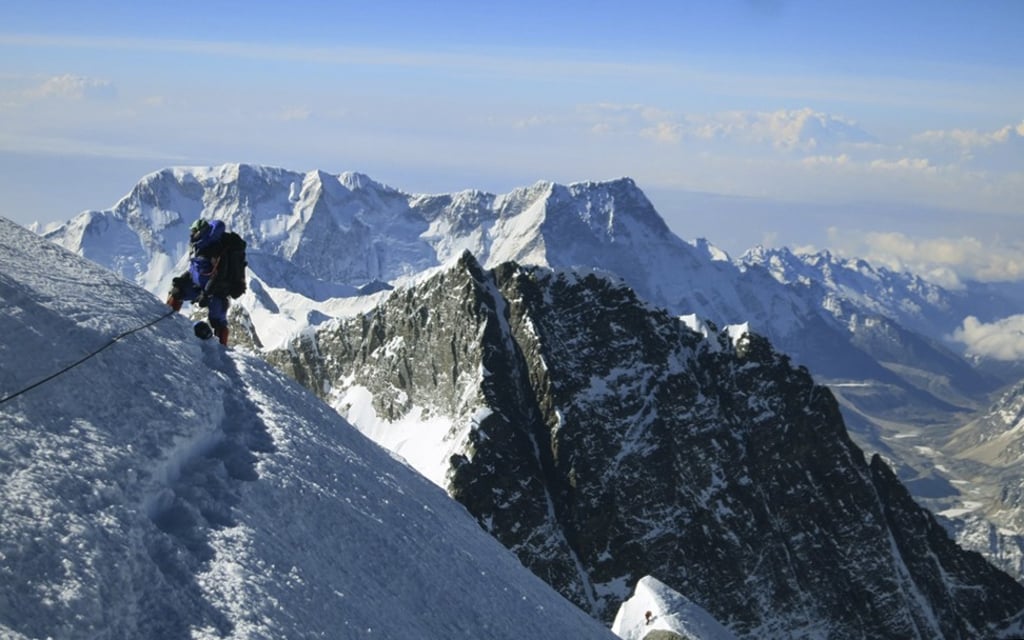 A climber pauses on the way to the summit of Mount Everest. Photo: AP A climber pauses on the way to the summit of Mount Everest. Photo: AP