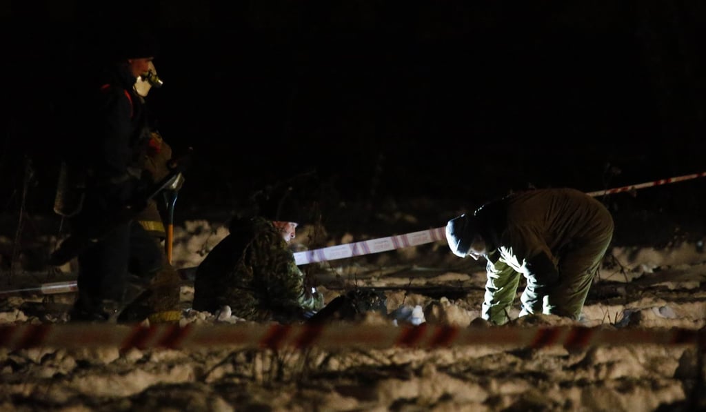 Emergency services work at the scene where a Saratov Airlines Antonov AN-148 plane crashed after taking off from Moscow's Domodedovo airport on Sunday. Photo: Reuters
