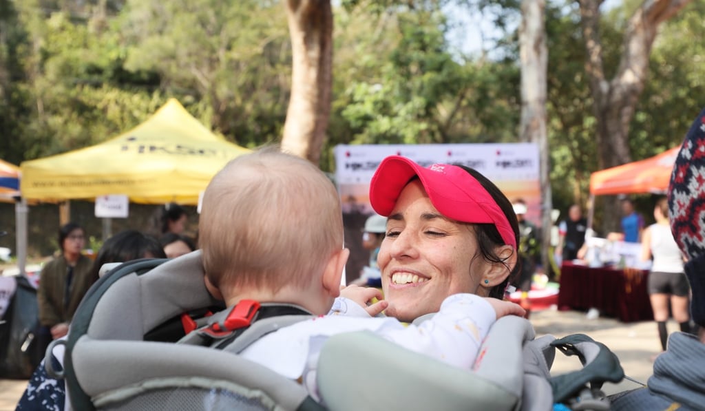 Nia Cooper greets her daughter after finishing first in the Sai Kung 50.