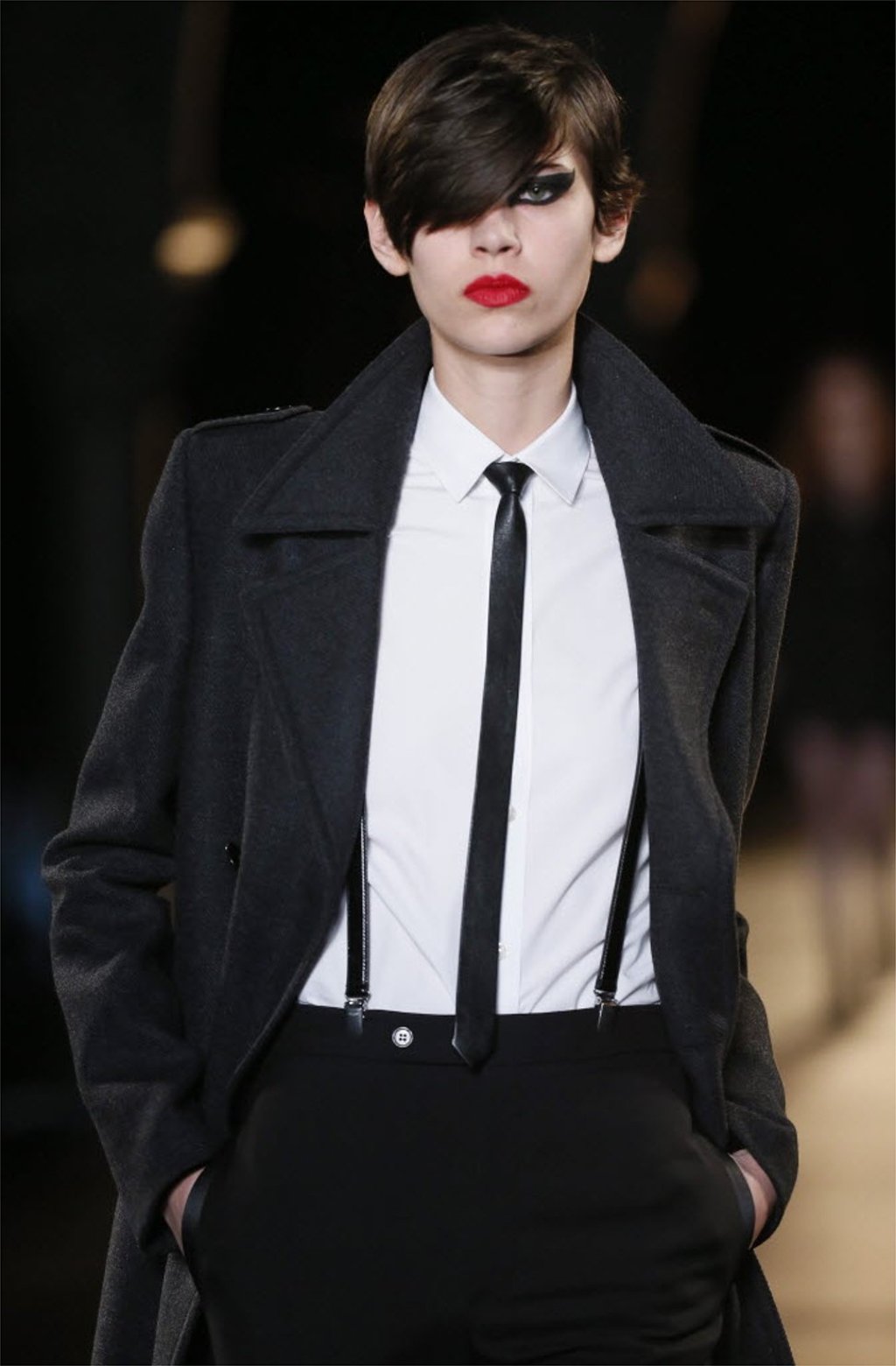 A model presents a creation from the Fall/Winter 2015/16 Ready to Wear collection by French designer Hedi Slimane for Saint Laurent Paris fashion house during the Paris Fashion Week, in Paris, France, 09 March 2015. Photo: EPA/IAN LANGSDON