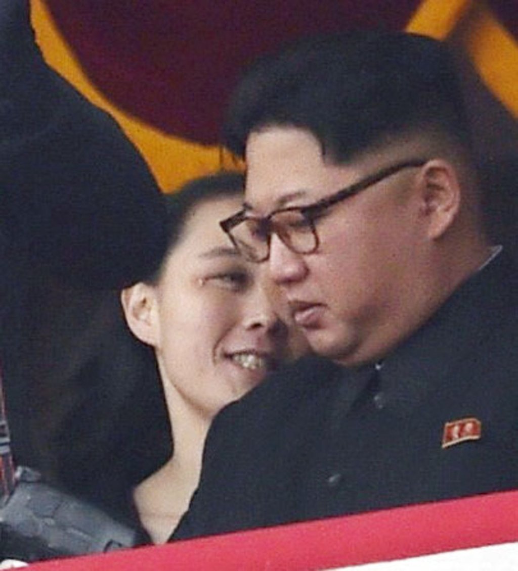 A photo taken on May 10, 2016, shows North Korean leader Kim Jong-un (right) and his younger sister, Kim Yo-jong, watching a parade in Kim Il-sung Square in Pyongyang. Photo: Kyodo
