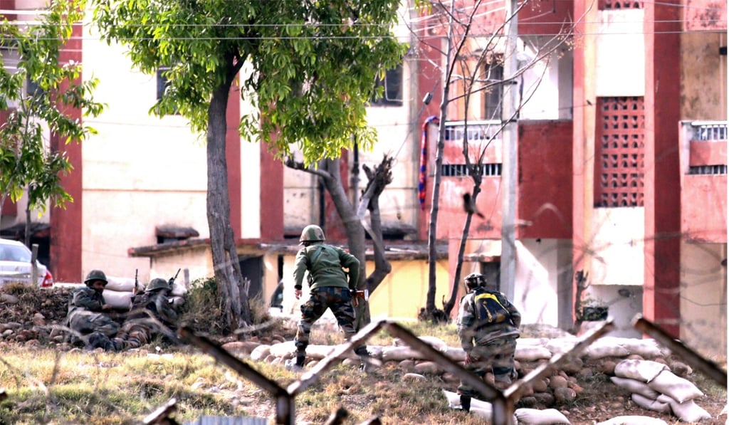 Indian army soldiers take position outside army family quarters where terrorists are believed to be holed up in Jammu on Sunday. Photo: EPA-EFE Indian army soldiers take position outside army family quarters where terrorists are believed to be holed up in Jammu on Sunday. Photo: EPA-EFE