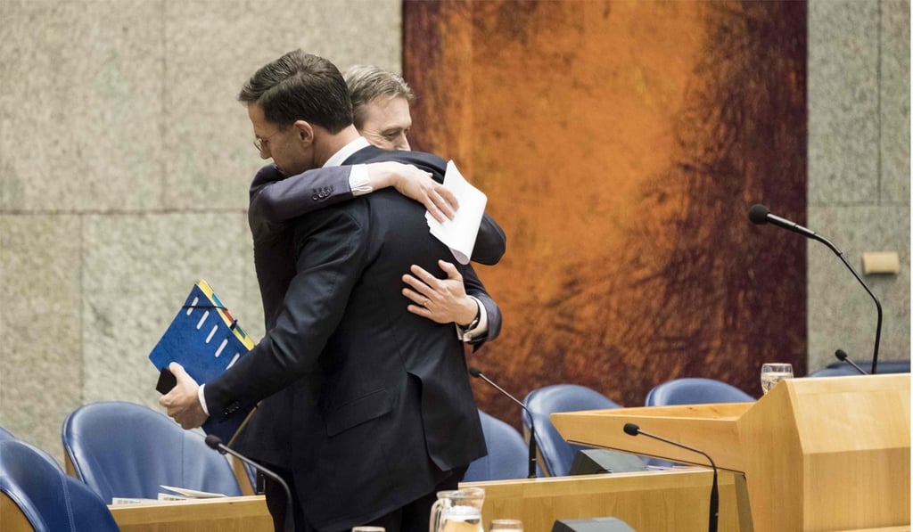 Zijlstra hugs Prime Minister Mark Rutte after announcing his resignation in the Dutch parliament on Tuesday. Photo: ANP via AFP Zijlstra hugs Prime Minister Mark Rutte after announcing his resignation in the Dutch parliament on Tuesday. Photo: ANP via AFP