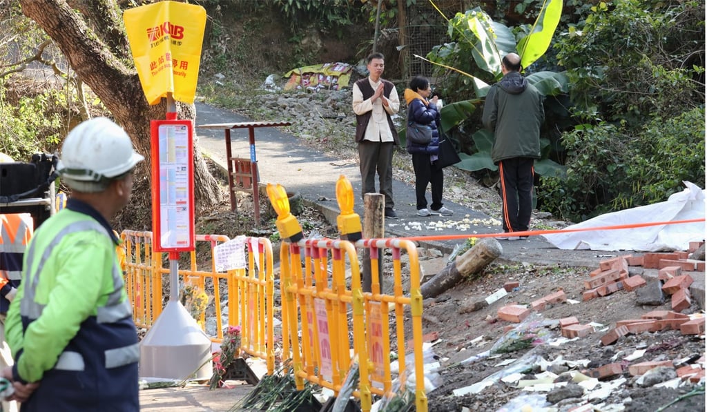 People performing mourning ritual at the site of the bus crash in Tai Po. Photo: Felix Wong