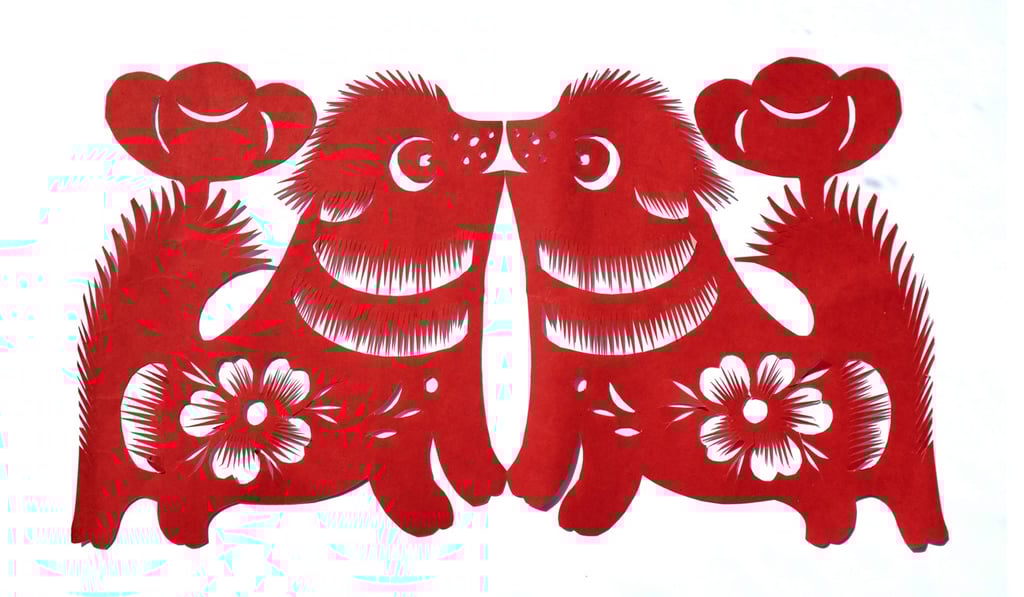 Li’s paper cutting to celebrate the Year of the Dog, complete with plum blossom design and gold ingot shapes. Photo: Antony Dickson