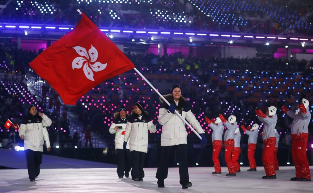 Arabella Ng of Hong Kong carries the national flag during the opening ceremony. Photo: Reuters
