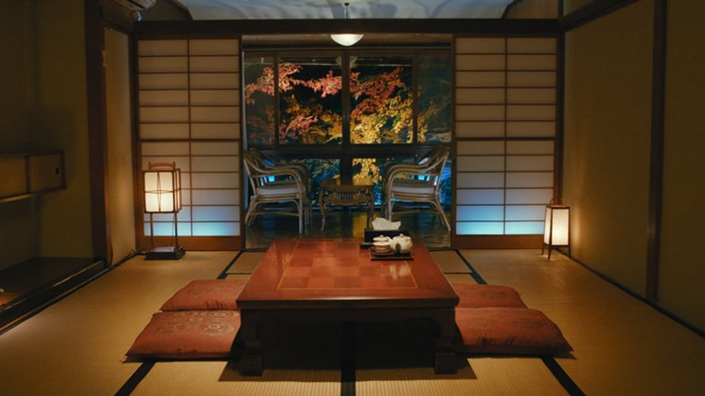A typical Japanese inn with Tatami flooring, a low table and floor cushions.