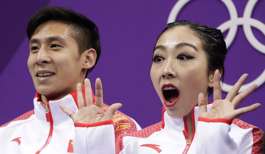 Sui Wenjing (right) and Han Cong after their score was announced. Photo: AP Sui Wenjing (right) and Han Cong after their score was announced. Photo: AP