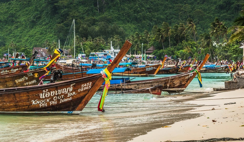 Tourist boats on Phi Phi Island. Tourist boats on Phi Phi Island.