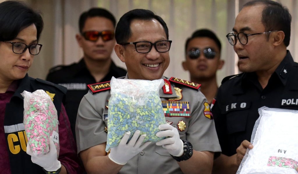 Indonesia's National Police chief General Tito Karnavian holds up a bag of seized drugs in Jakarta last year. Photo: EPA