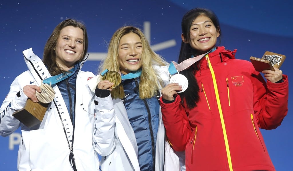 Chloe Kim with Liu Jiayu (right) and Arielle Gold. Photo: EPA