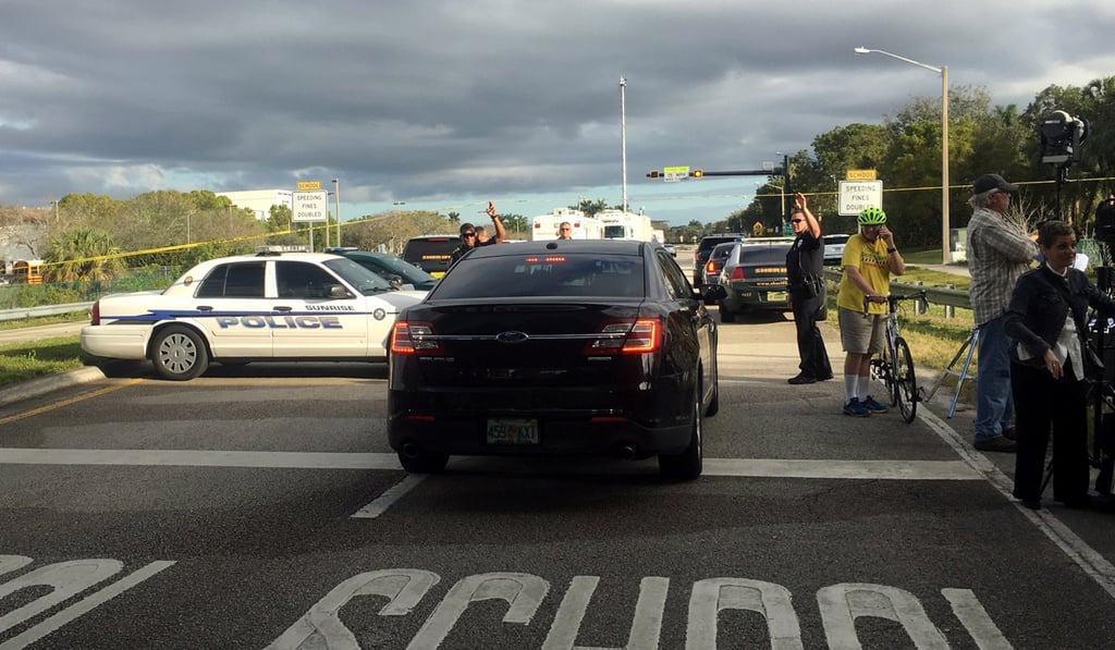 Police patrol the area outside Marjory Stoneman Douglas High School following a school shooting incident in Parkland, Florida, on February 15, 2018. Photo: Reuters