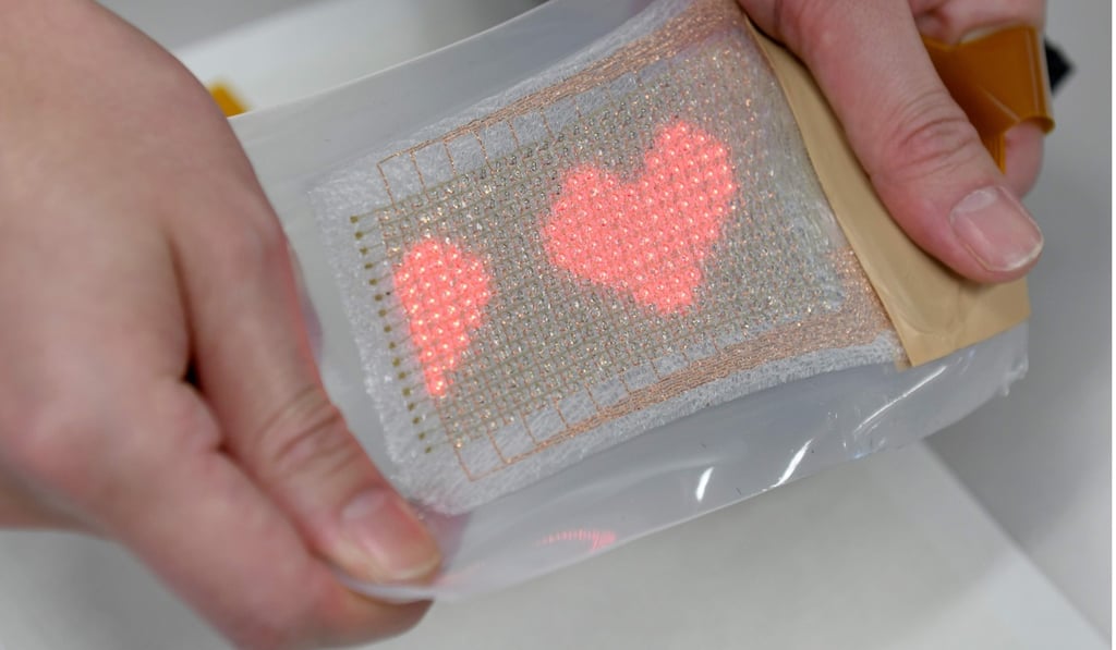 The ultra-thin elastic ‘skin’ equipped with an LED display that can monitor important health data as well as send and receive messages, including emojis. Photo: AFP