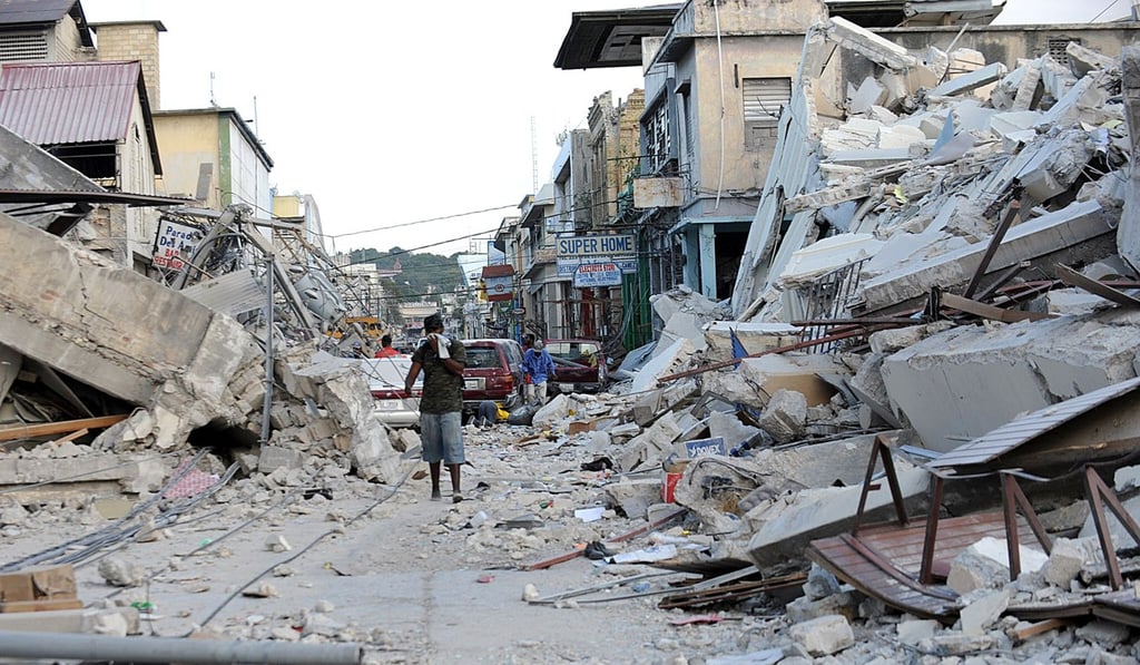 In this file photo taken on January 14, 2010 a man covers his face as he walks amid the rubble of a destroyed building in Port-au-Prince on January 14, 2010, following the devastating earthquake that rocked Haiti on January 12. Photo: Agence France-Presse In this file photo taken on January 14, 2010 a man covers his face as he walks amid the rubble of a destroyed building in Port-au-Prince on January 14, 2010, following the devastating earthquake that rocked Haiti on January 12. Photo: Agence France-Presse
