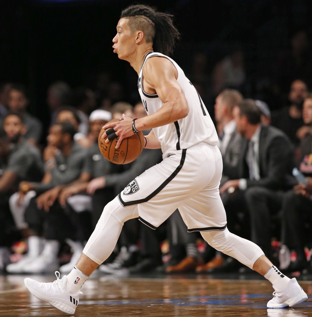Lin looks to pass the ball against the Miami Heat. Photo: AP