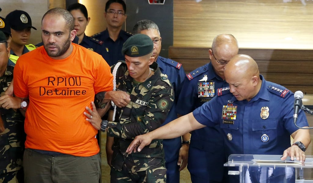 Philippine National Police Chief General Ronald Dela Rosa presents to the media arrested foreigner Fehmi Lassoued on February 19, 2018 at Camp Crame in suburban Quezon City. Photo: AP Philippine National Police Chief General Ronald Dela Rosa presents to the media arrested foreigner Fehmi Lassoued on February 19, 2018 at Camp Crame in suburban Quezon City. Photo: AP