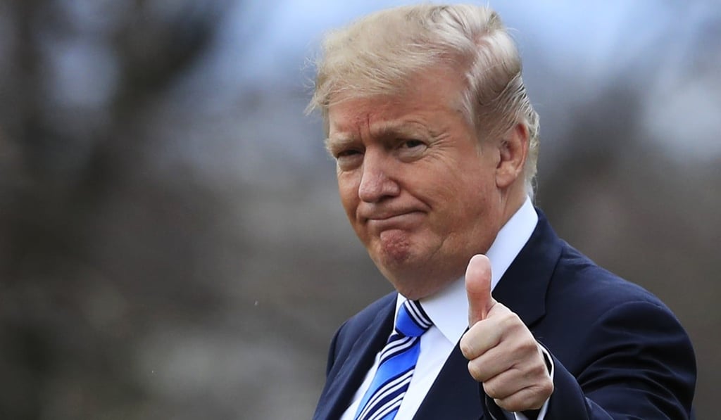 President Donald Trump gestures to the media as he leaves the White House for Mar-a-Lago on Friday. Photo: AP President Donald Trump gestures to the media as he leaves the White House for Mar-a-Lago on Friday. Photo: AP