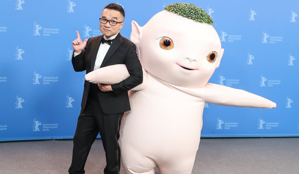 Raman Hui poses with an actor dressed as Wuba, lead character of his film Monster Hunt 2, at the Berlin International Film Festival, where the film was shown out of competition. Photo: Xinhua