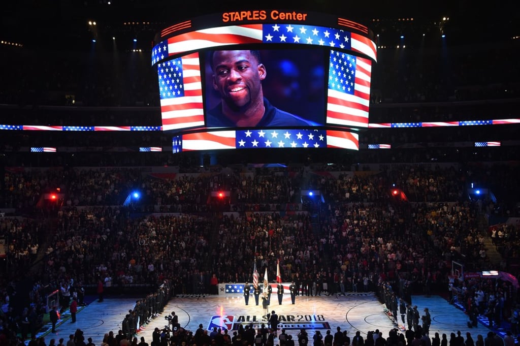 NBA All-Star Draymond Green (on screen) cracks a smile as Fergie performs. Photo: AFP NBA All-Star Draymond Green (on screen) cracks a smile as Fergie performs. Photo: AFP