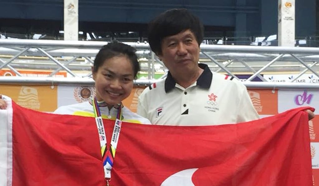 Hong Kong's Sarah Lee celebrates with her coach, Shen Jinkang.