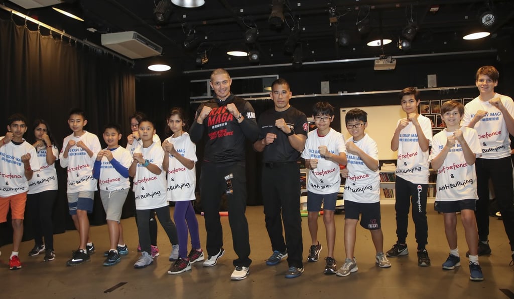Donovan Ryan leads a self-defence class at West Island School in Hong Kong. Among those taking the class is Alex Corner (far right). Photo: Edward Wong