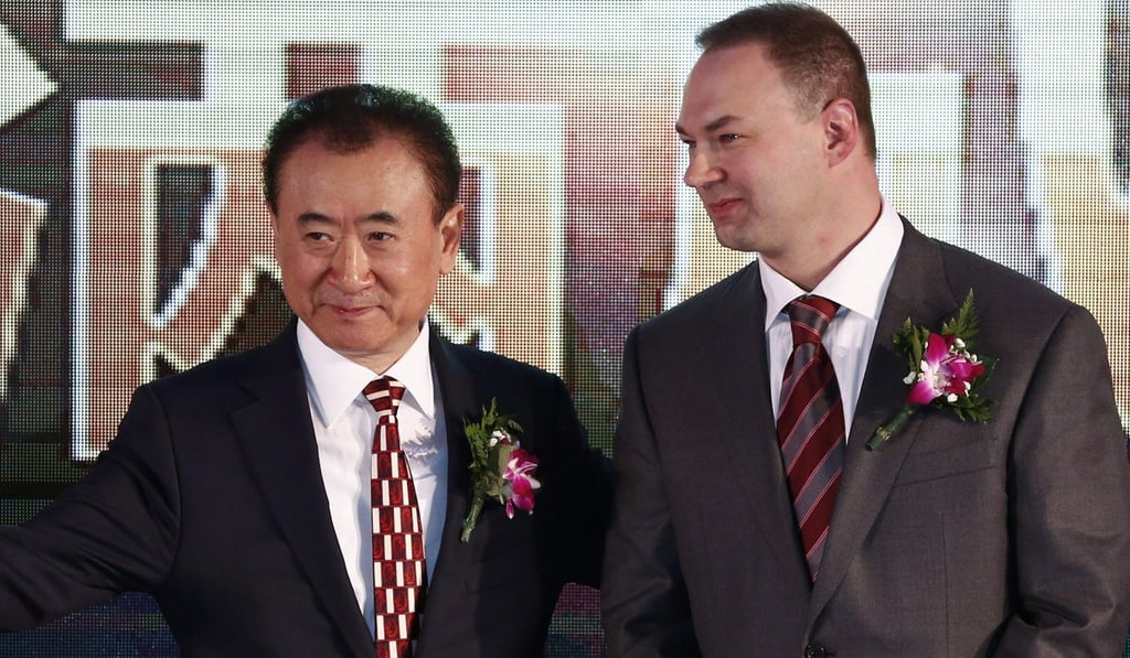 Left, Wang Jianlin, chairman of Wanda Group with Thomas Tull, founder of Legendary Entertainment, at an event to mark the acquisition of the US film studio, on January 12, 2016, in Beijing. Photo: EPA