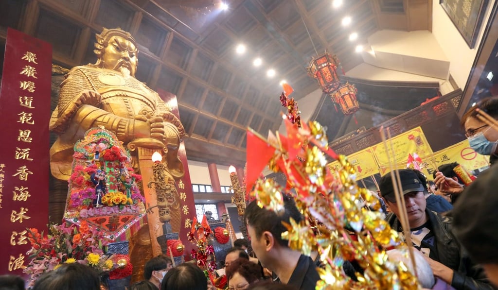 Worshippers visit Che Kung Temple in Sha Tin to pray for good luck and prosperity in the Year of the Dog on the third day of the Lunar New Year. Photo: Felix Wong
