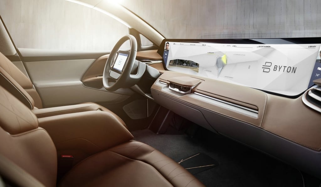 A full-width infotainment screen on the Byton dashboard