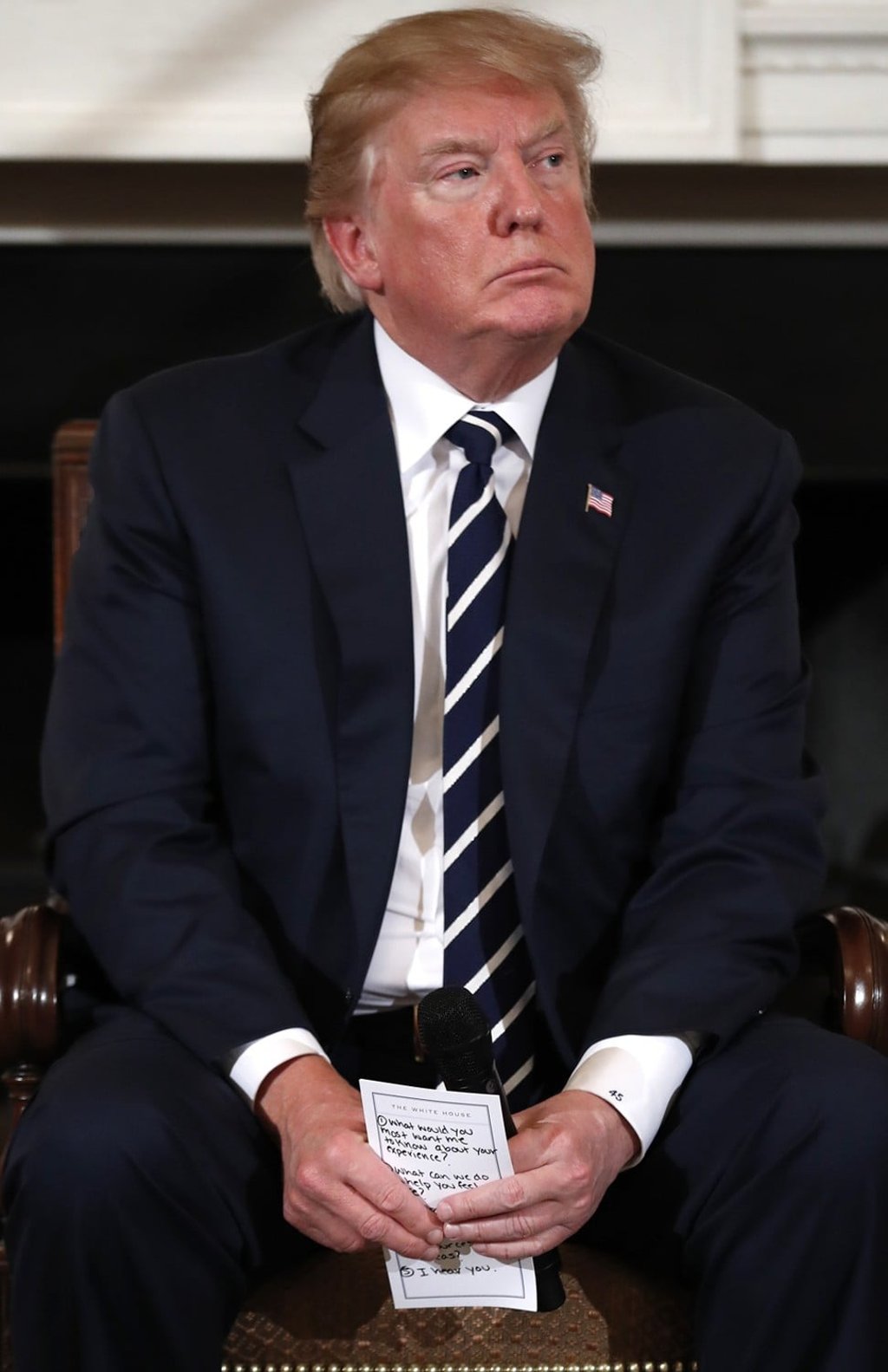 Donald Trump holds notes during the listening session with high school students. Photo: AP Donald Trump holds notes during the listening session with high school students. Photo: AP