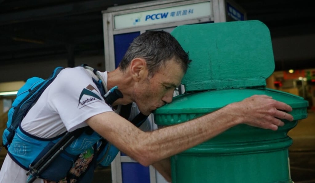 Will Hayward kisses the postbox that marks the end of the HK4TUC. Will Hayward kisses the postbox that marks the end of the HK4TUC.