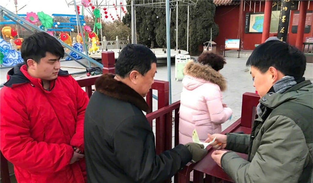 The names and faces of the missing children, along with phone numbers for their parents, were printed on the back of entrance tickets to the park in Kaifeng. Photo: CNA