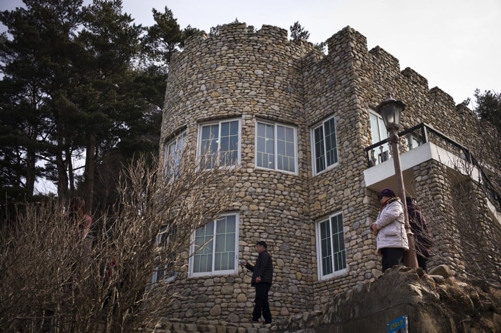 Visitors stand outside Kim Il-sung’s villa. The villa belonged to North Korea before the 1950-53 Korean war. Photo: AP