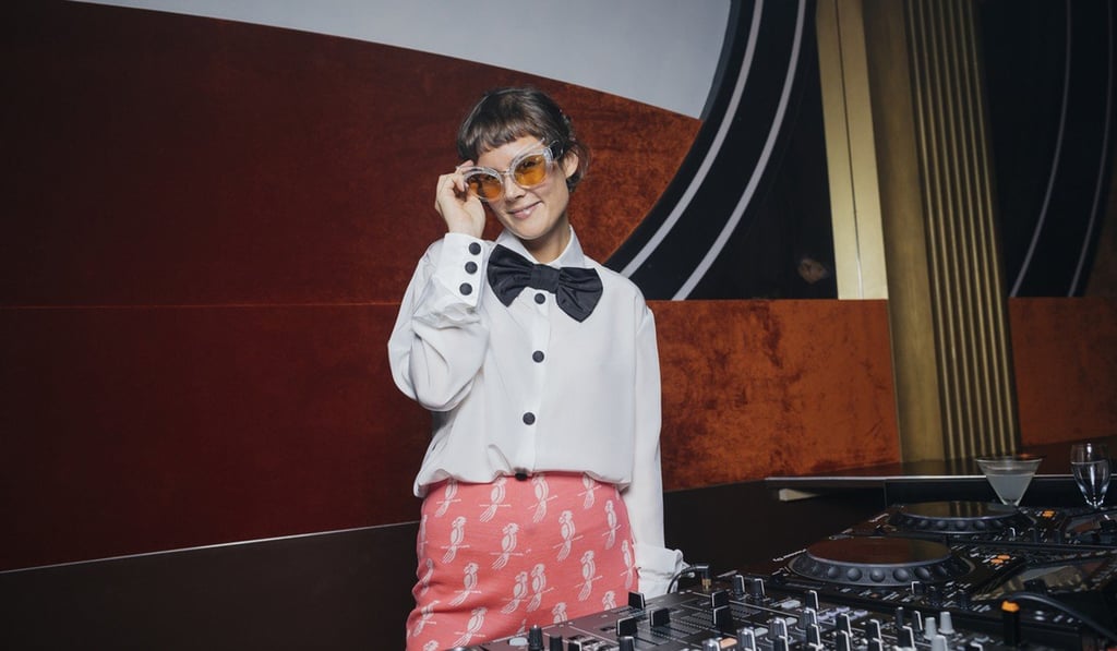 Louise Chen DJing at a Miu Miu party.