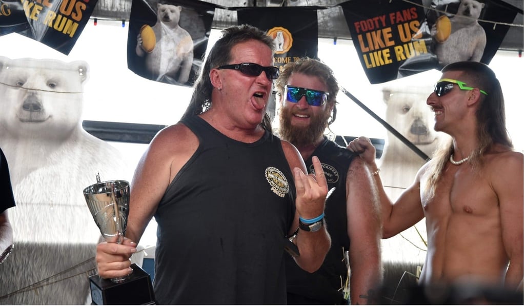 Thirty-one-year-old Australian Shane Hanrahan celebrates winning ‘best mullet’ award at Mulletfest 2018. Photo: AFP