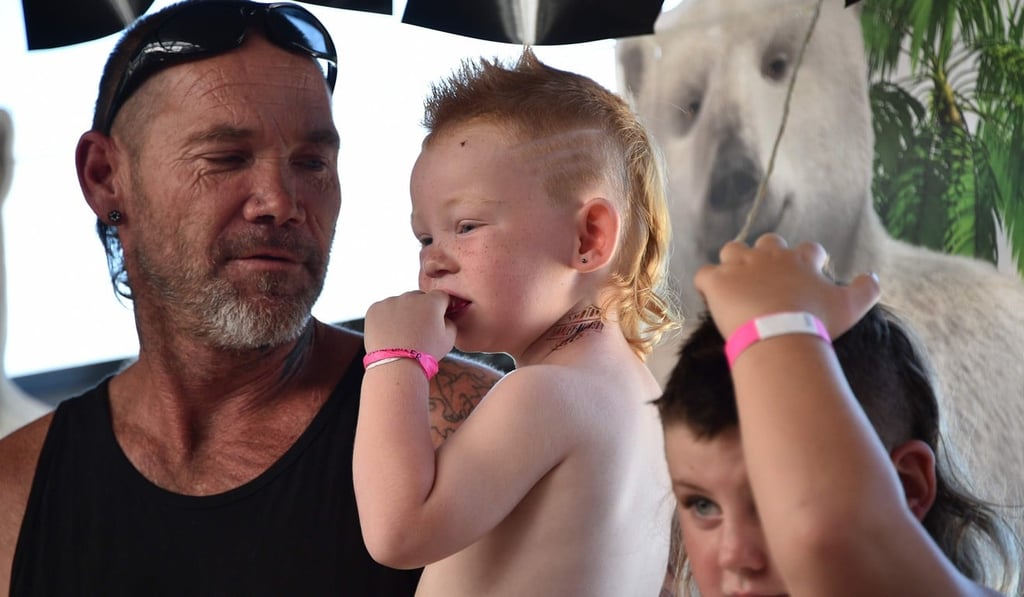 A family shows off their mullets at Mulletfest 2018. Photo: AFP