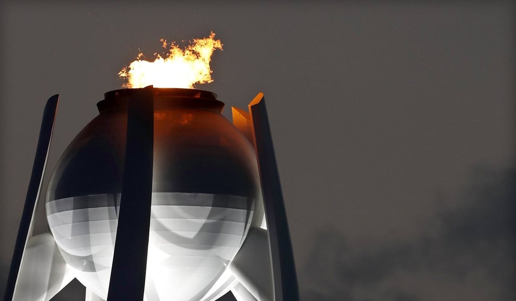 The Olympic flame burns in the cauldron at the Olympic Stadium. Photo: EPA