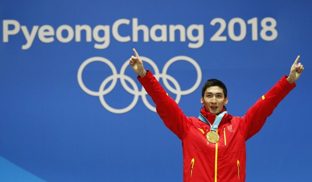 China’s sole gold medallist Wu Dajing of China celebrates during the medal ceremony for the men's 500m Short Track. Photo: EPA