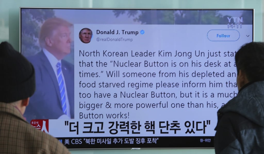South Koreans read Trump’s infamous tweet about his bigger nuclear button. Photo: AP