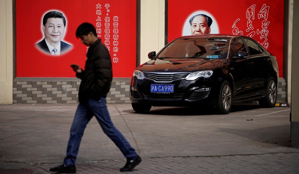 Pictures of President Xi Jinping and the late Mao Zedong overlook a street in Shanghai. Will continuity of leadership hold China back, as Mao’s long run did, or will there be value for China and the world to keeping one map at the top? Photo: Reuters