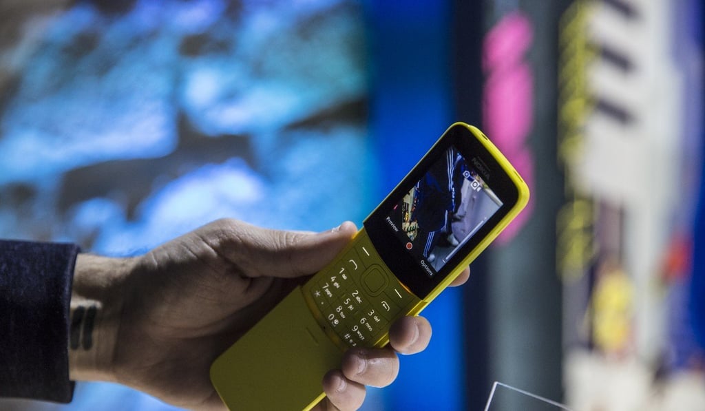 An attendee holds a yellow Nokia 8110 4G smartphone, manufactured by HMD Global Oy, during a launch event ahead of the Mobile World Congress (MWC) in Barcelona, Spain, on Sunday, Feb. 25, 2018. Photo: Bloomberg An attendee holds a yellow Nokia 8110 4G smartphone, manufactured by HMD Global Oy, during a launch event ahead of the Mobile World Congress (MWC) in Barcelona, Spain, on Sunday, Feb. 25, 2018. Photo: Bloomberg