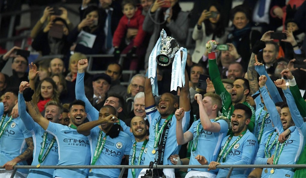 Manchester City players celebrate winning the League Cup after a 3-0 win over Arsenal. Photo: EPA Manchester City players celebrate winning the League Cup after a 3-0 win over Arsenal. Photo: EPA