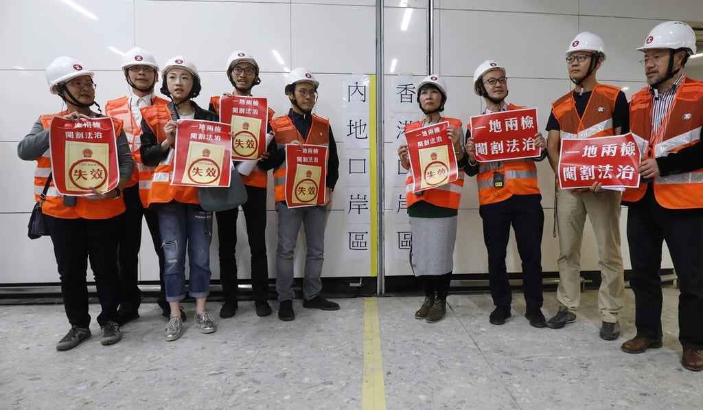 Hong Kong’s security, justice and transport chiefs accompanied about 30 lawmakers on a tour of the rail terminal on Tuesday. Photo: Handout