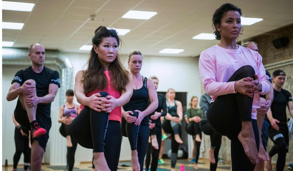 Employees of Bjoern Borg sportswear brand are pictured during a yoga class on January 26, 2018 in Stockholm. Photo: Agence France-Presse