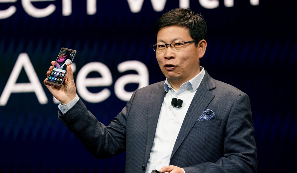 Richard Yu, CEO of the Huawei Consumer Business Group, holding a Huawei Mate 10 Pro cellphone, speaks at the Huawei keynote at CES in Las Vegas, Nevada. Photo: Reuters
